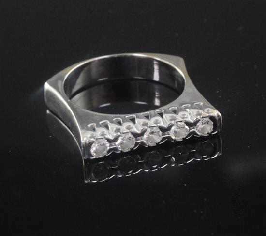 A modern white gold and five stone channel set diamond ring,